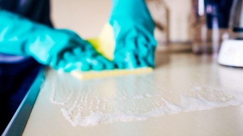 Local technician preparing carpets for hot water extraction cleaning