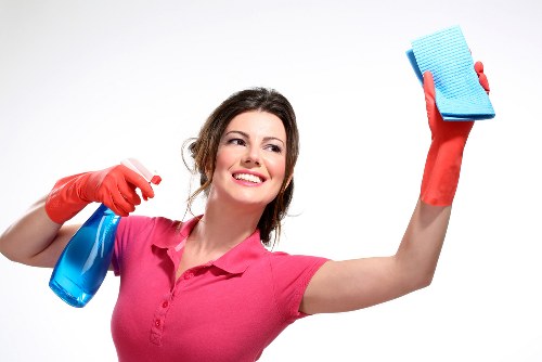 Trained cleaner applying careful procedures in a home environment